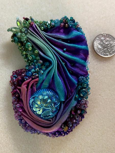 Purple, turquoise and green pin