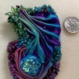 Purple, turquoise and green pin