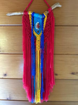 Red/yellow/turquoise Macrame with a hand made wire wrapped glass bead