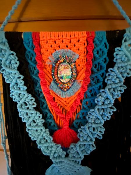Black/orange Macrame with bead embroidery around a dichroic glass centerpiece